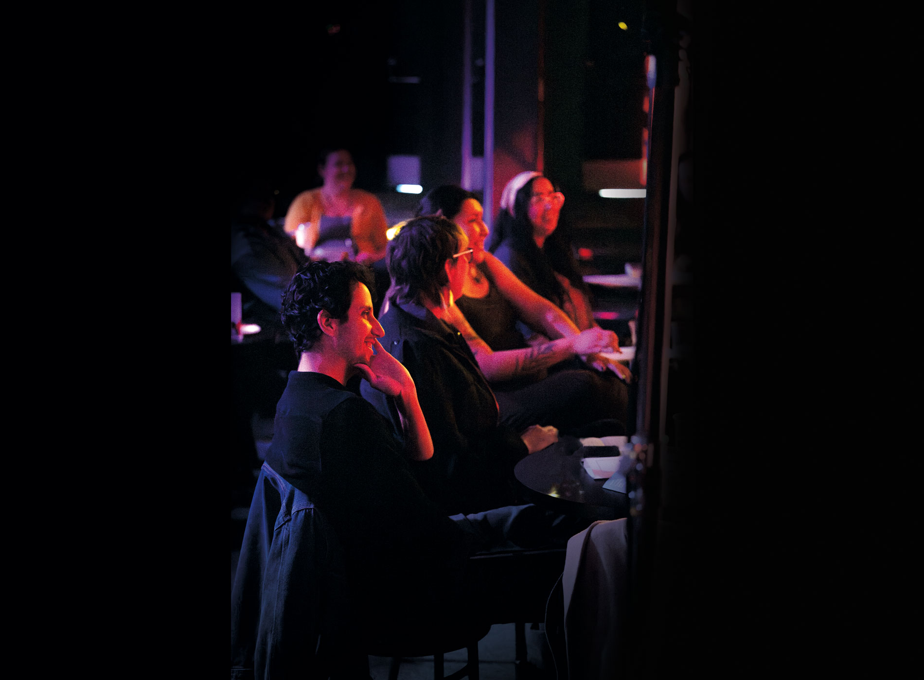 Audience members smiling