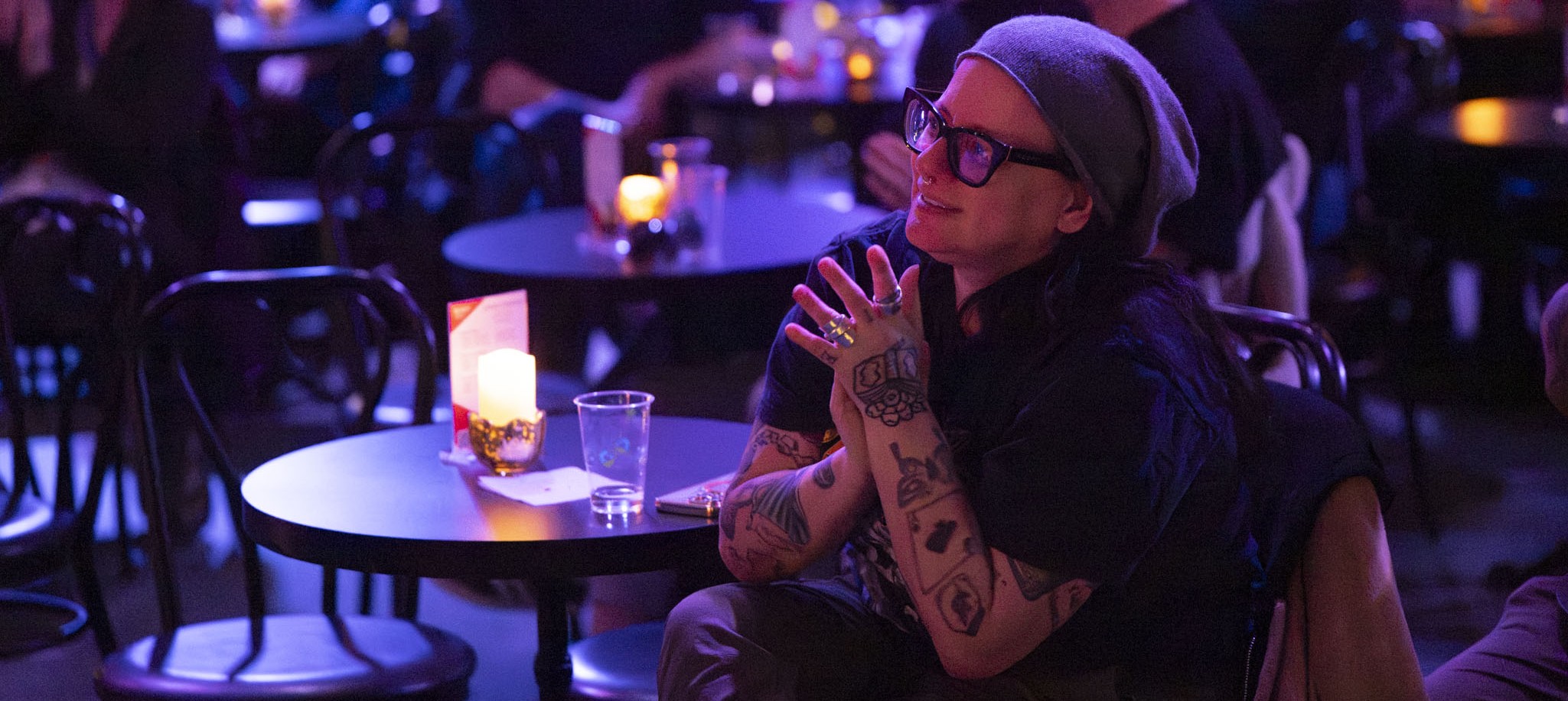 Person sitting a table in ClVB '33 Clapping