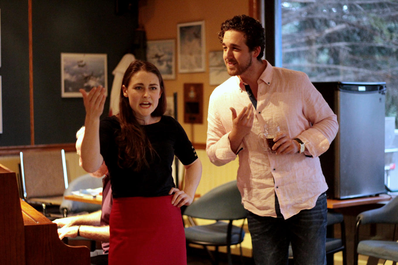 woman and man singing, woman looks frustrated