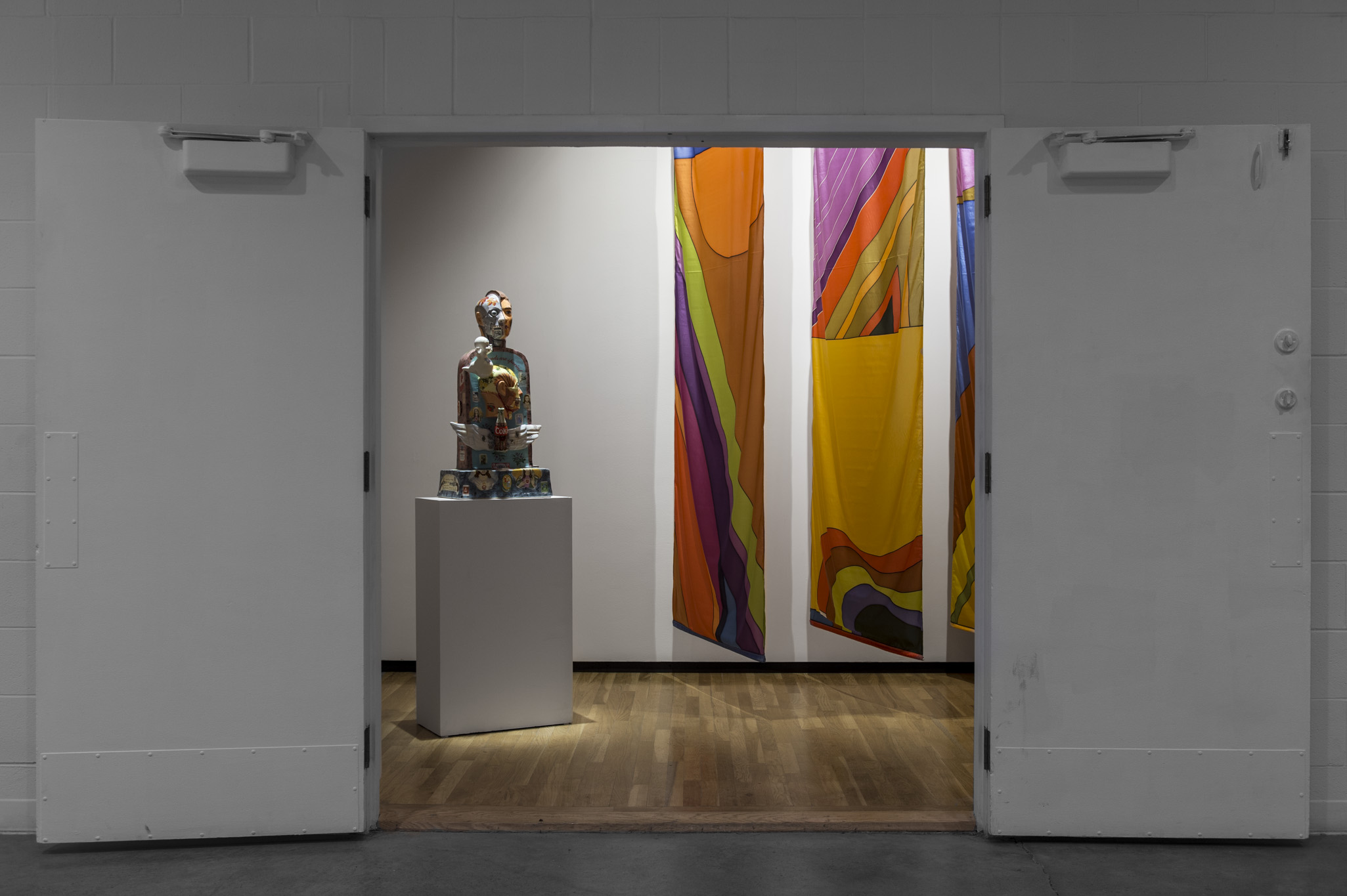 Installation view of Takao Tanabe, ``Untitled *3 Nylon Banners*`` (1978) and John de Fazio, ``PMS Tombstone`` (1996). Wa