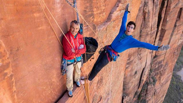 Two climbers are resting on the pitch.