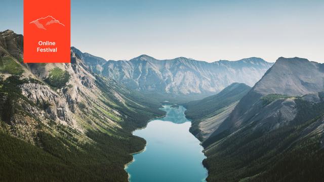 Banner showing a beautiful mountain valley with a lake in the middle.