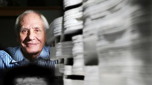 Douglas Cardinal with a model of the National Museum of the American Indian 