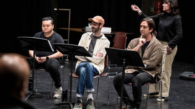 Three actors and an ASL interpreter read through a script together