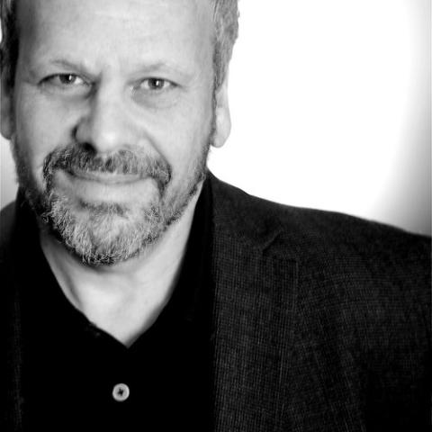 Black and white headshot of Larry Weinstein