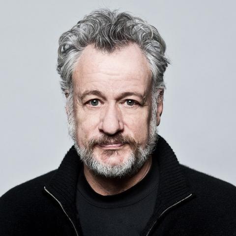 Headshot of John de Lanci