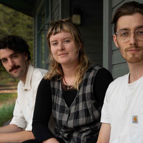 Members of Instruction Manual sitting outside the Banff Centre Music Building