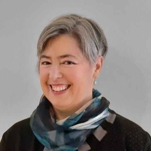 Musician Susan Sinclair smiles at the camera