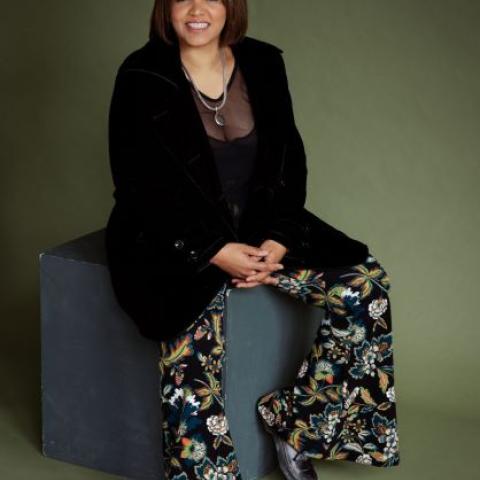 Program Faculty Terri Lyne Carrington sitting smiling at the camera